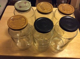 LOT OF 6 GLASS JARS 25 oz WITH SCREW ON LIDS - $29.77