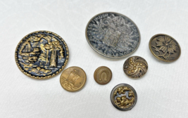 7 Antique Round Metal Picture Buttons Flowers Castle Ship Horseshoe Desi... - $341.48 MXN