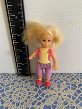 Fisher price loving family Girl Sister with Yellow Shirt &amp; Purple Shorts Doll - £6.93 GBP