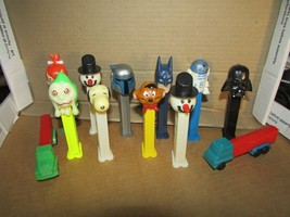 TOY PEZ DISPENSER LOT OF 12 STAR WARS SNOWMAN SNOOPY TRUCKS PEBBLES BATM... - $18.00