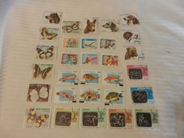 Lot of 30 Mozambique Stamps Dogs, Sports, Butterflies, from 1970s - $30.00