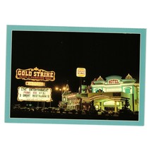 Vintage Postcard Gold Strike Hotel Gambling Hall Evening Lights Jean Nevada - £7.57 GBP