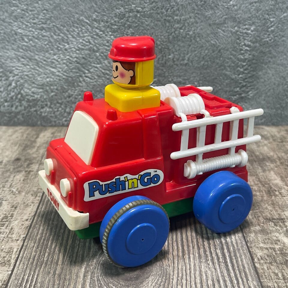 Primary image for Vintage Working 1975 Tomy Push N Go Fire Truck Toy