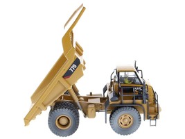 CAT Caterpillar 770 Off-Highway Truck Yellow (Weathered) with Operator Weathered - $3,879.01 MXN
