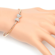 Rose Tone Bangle Bracelet With Sparkling Crystal Bow - £21.96 GBP