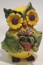 Owl figurine with Sunflower eyes and leaf arms holding a house plant - $14.99