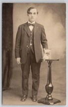RPPC Gentleman Posing With Framed Portrait On Table Studio Photo Postcard R30 - £10.97 GBP
