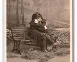 RPPC Bamforth Romance On the Benches In The Park DB Postcard V1 - $4.90