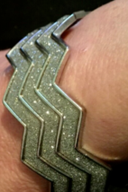 Bracelet / cuff style silver color with lots of sparkles - $5.83