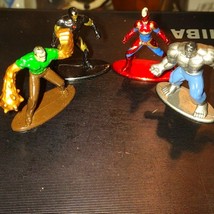 Four marvel iron metal miniature statues - $20.79