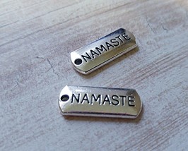 4 Namaste Charms Antiqued Silver Word Charms Yoga Pendants Jewelry Tags - £2.07 GBP