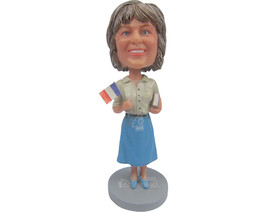 Custom Bobblehead Sophisticated Lady In Skirt With Book And A Flag In Ha... - $83.00