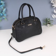 Guess a leather bag with internal openings, a zipper, two short handles العلامة - £79.91 GBP