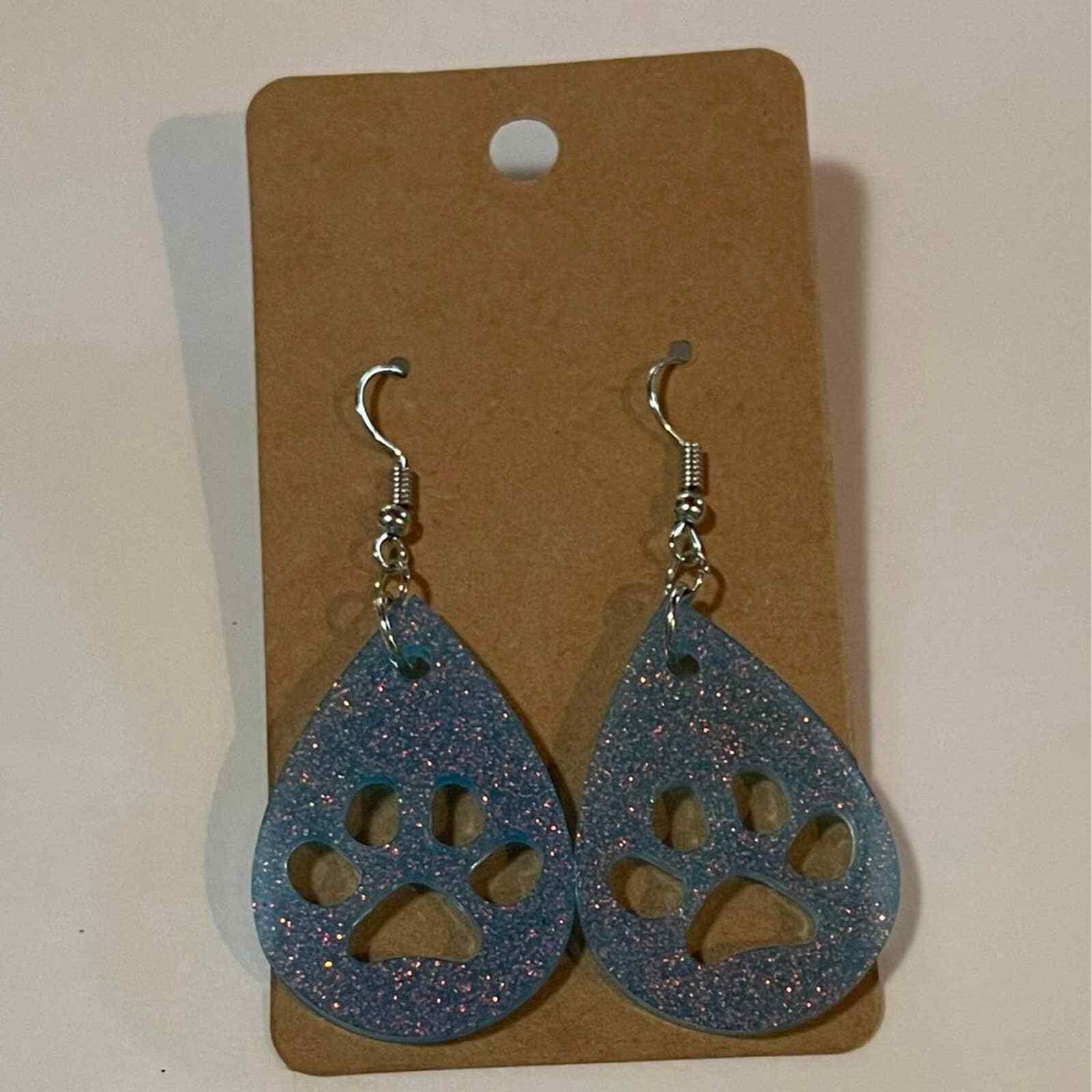 Primary image for Handmade epoxy resin paw print earrings - light blue glitter w/ rosegold flecks