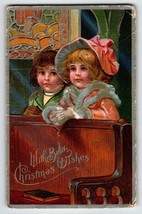 Christmas Postcard Victorian Boy And Girl Seated On Church Pews Embossed 1909 - £10.40 GBP