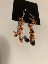 pierced earrings orange black white beaded dangle - £23.42 GBP