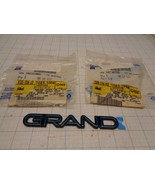GM 10230998 and 10231005 Emblem Name Plate Aqua Grand Prix 3 PCS   OEM NOS - $45.98
