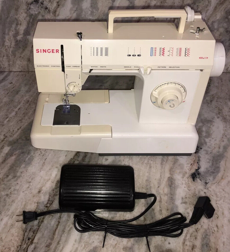 Buy the Singer 6215C Free Arm Zig-Zag Portable Electric Sewing Machine