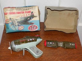 Vintage P-47 Thunderbolt Cap Firing Tin Fighter Plane in Box!. - $198.00