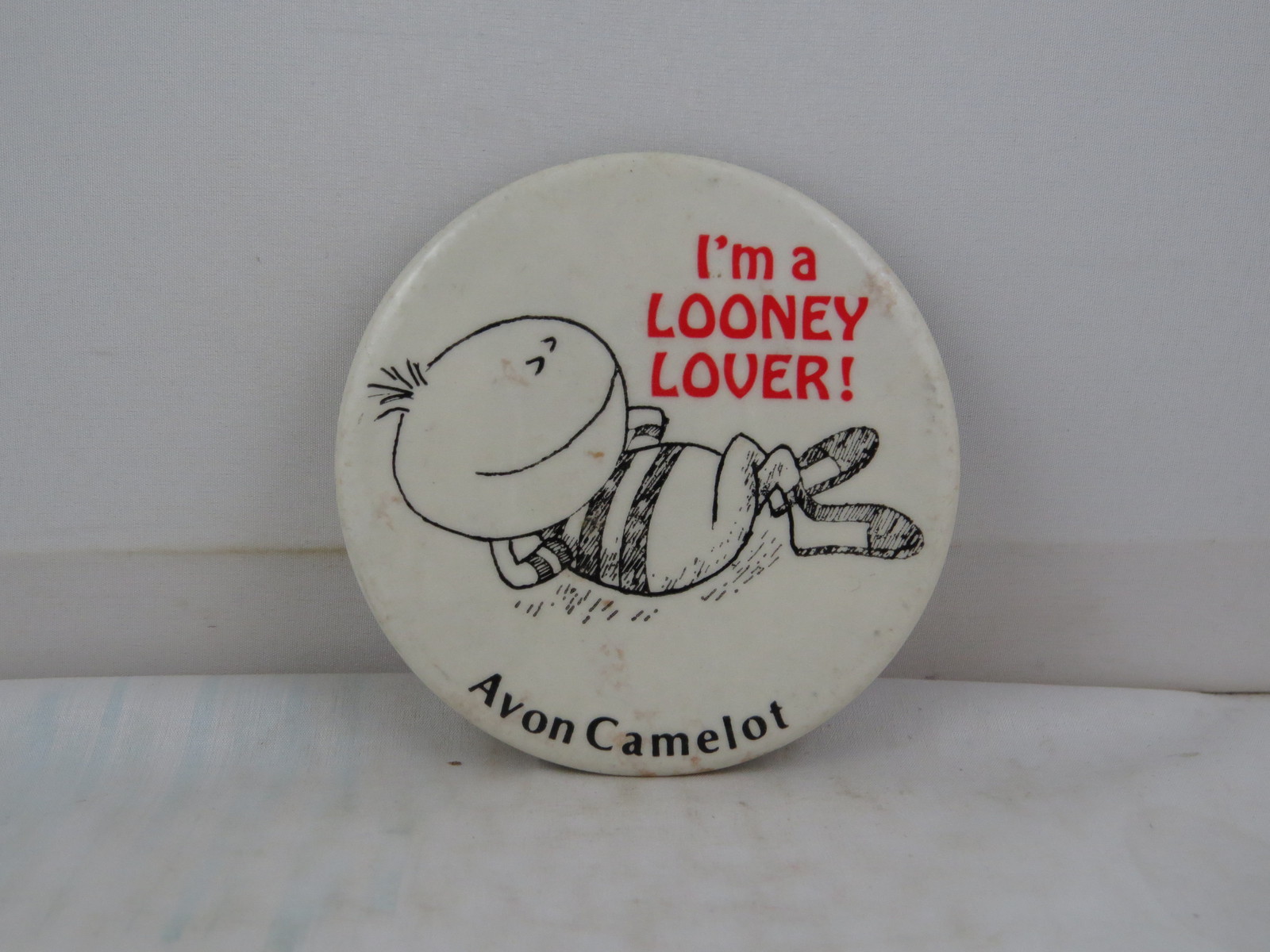 Vintage Book Pin - Avon Camelot Publisher's Looney Lover - Celluloid Pin  - £11.88 GBP