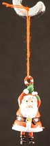 Neat Little Metal Santa Claus Ornament Hanging by A Candy Cane Swinging Legs - £13.17 GBP