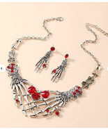 Skeleton hand heart red crystal necklace earrings - $306.34 MXN