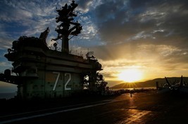 Sun sets over the aircraft carrier USS Abraham Lincoln CVN-72 Photo Print - $8.81+