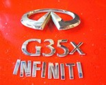 2003 2004 2005 2006 Infiniti G35x Trunk Emblem Badge Set OEM P/N 84890AC000 - $22.49