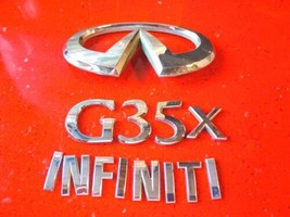 2003 2004 2005 2006 Infiniti G35x Trunk Emblem Badge Set OEM P/N 84890AC000 - £17.71 GBP