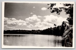 RPPC Beautiful Lake Scene Surrounded by Pines Clouds Passing Postcard I23 - £6.25 GBP