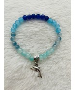 Dark blue, blue, and light blue glass bead bracelet with dolphin charm. - $7.00
