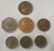 Great Britian One Penny, 50 Pence, Half Penny, One Penny,  three 1 Pound Coins - £3.91 GBP