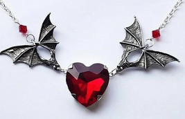 Bat wing red heart necklace - $241.39 MXN