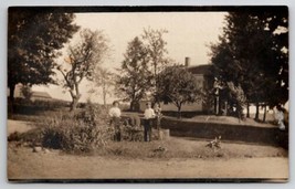 RPPC Woman and Man We just Planted A New Tree Take a Photo Postcard I22 - £4.68 GBP