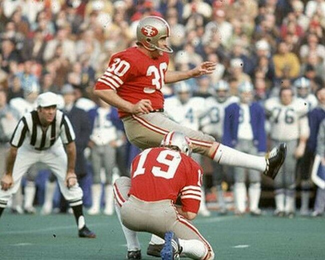 Primary image for BRUCE GOSSETT 8X10 PHOTO SAN FRANCISCO 49ers FORTY NINERS PICTURE FOOTBALL KICK