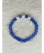 Purple glass bead bracelet with three plastic pearls. - $7.00