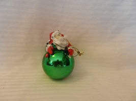 Resin Santa Claus Laying on Glass Ornament With Christmas Lights - £11.96 GBP