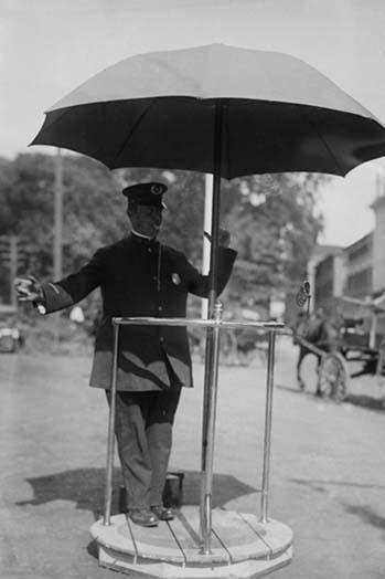 Policeman Directs traffic from underneath an umbrella in Newport, Rhode Island - $19.97
