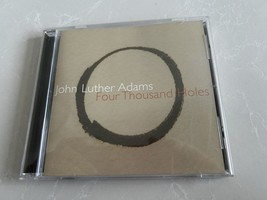JOHN LUTHER ADAMS: FOUR THOUSAND HOLES CD - $72.43 MXN