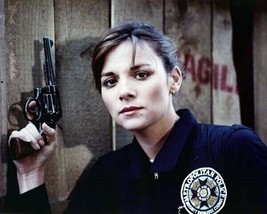 Kim Cattrall in police uniform holding gun 1984 Police Academy 11x17 inch poster - $19.99