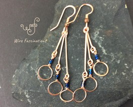 Handmade copper earrings: long circle dangles with dark crystal blue beads - £23.97 GBP
