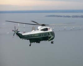 President Donald Trump rides aboard Marine One helicopter to Dover Photo Print - $8.81+