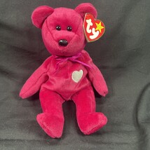 TY Beanie Baby Valentina Pink Teddy Bear with a White Heart with Tags 1999 - $127.36 MXN TY Beanie Baby Valentina Pink Teddy Bear with a White Heart with Tags 1999 - $127.36 MXN