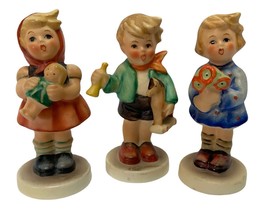 Vintage GOEBEL Figurines Boy with Horn Girl Flower Bouquet and Doll West Germany - £28.85 GBP