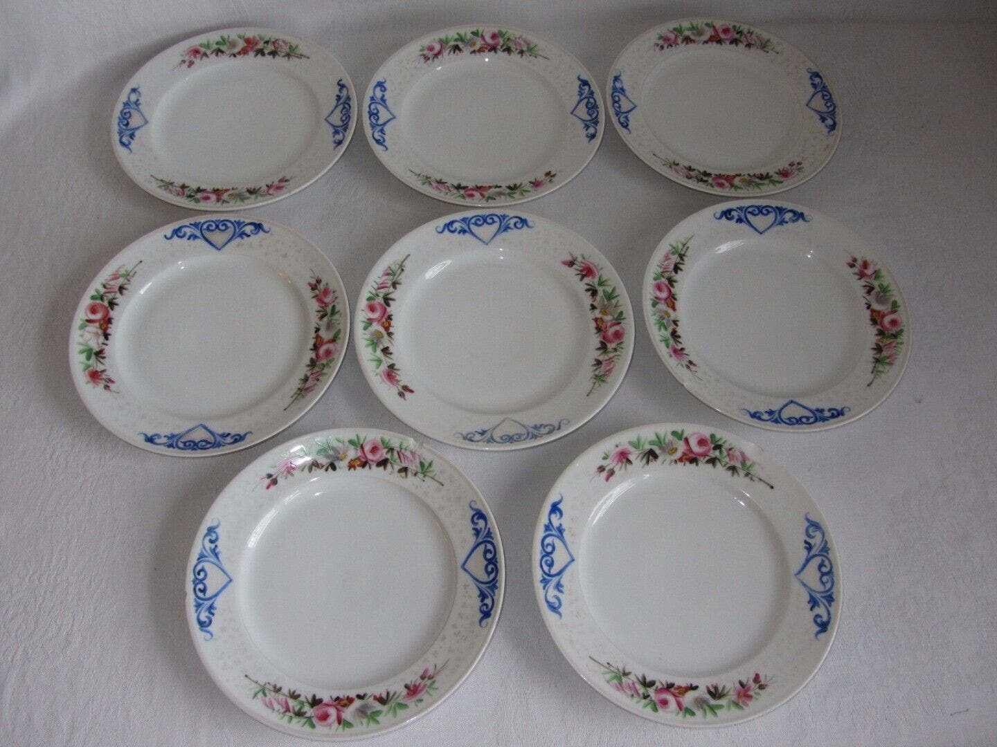 Primary image for Set of 8 Vtg Salad Dessert Plates White Ceramic Hand Painted Floral Blue Heart