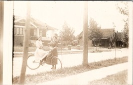 Two Young Ladies Bicycle on Residential Street Women Porch Sitting Postcard Y17 - £13.25 GBP