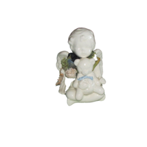 ANGEL holding bear, ceramic white w/ blue flowers (liv rm shlv)) - $6.00
