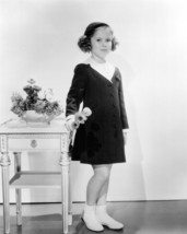 Shirley Temple holding flowers in coat and hat 4x6 inch photo - £4.69 GBP