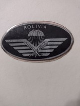 PARACHUTE BADGE, BOLIVIA,  GOLD INSIGNIA IN CLEAR PLASTIC - £5.47 GBP