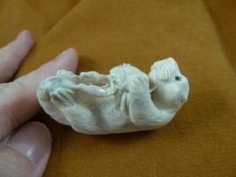 ott-w5 little Otter holding a crab of shed ANTLER figurine Bali detailed... - $114.30